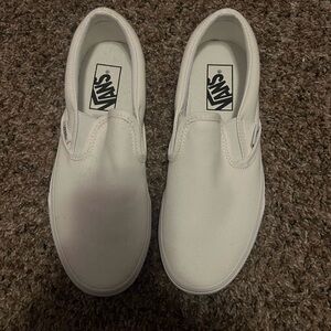 All white slip on vans